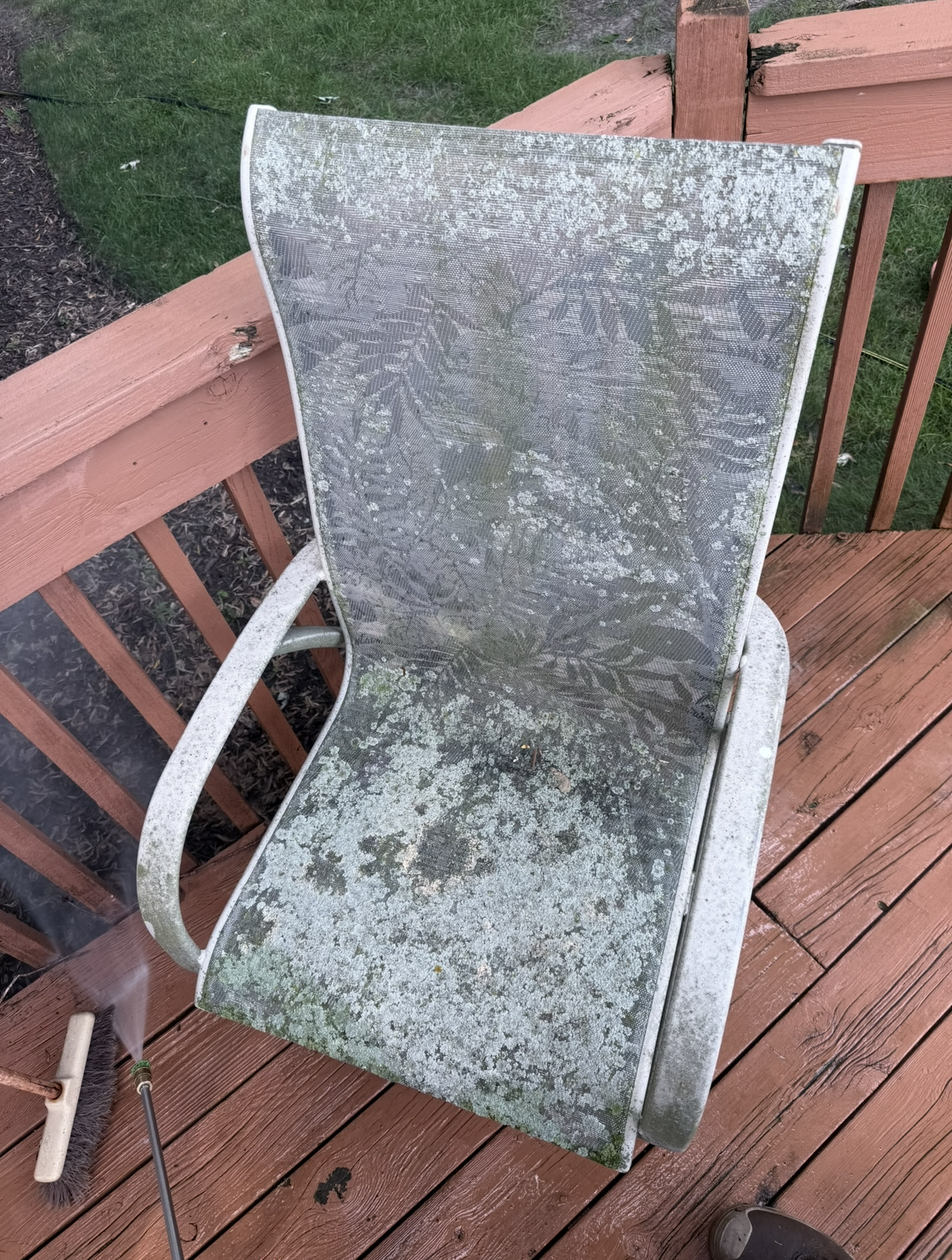 Patio chair covered in mildew before cleaning