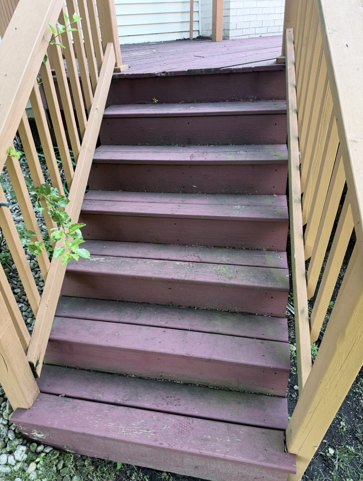 Wood deck stairs before pressure washing